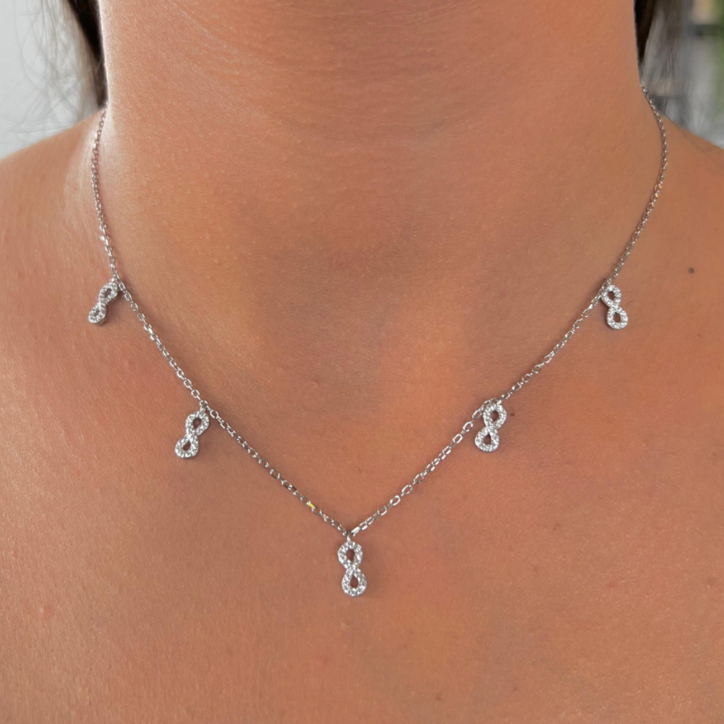 COLLAR DE PLATA CON 5 SIGNOS INFINITOS Y CIRCONES